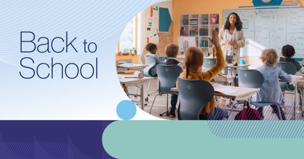 Back to School with image of teacher facing her elementary school class