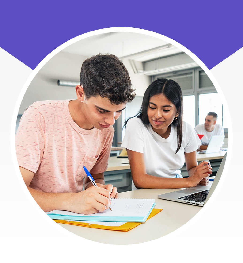 Two students working together on a writing project