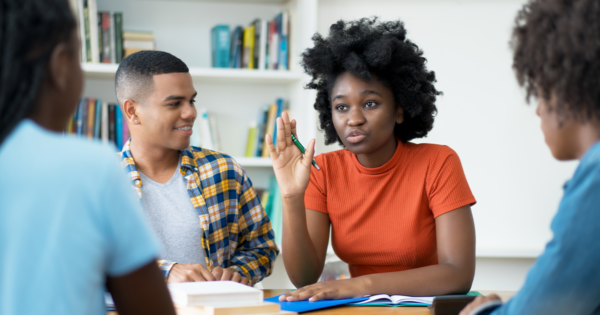 Students in discussion around a table