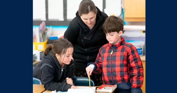 Photo of two students and a teacher