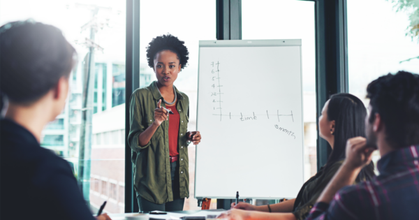 Woman instructing students in classroom