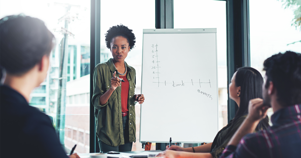 Woman instructing students in classroom