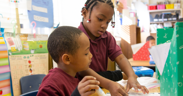 Photo of kids writing